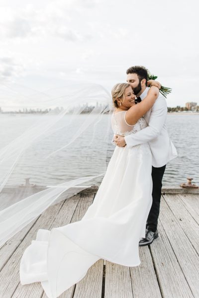 Bride and groom on pier