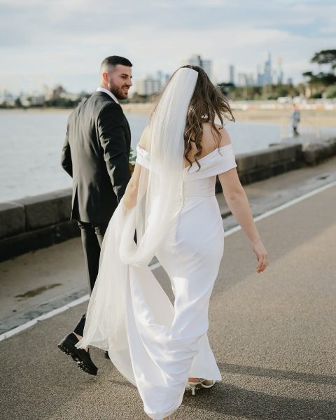 Couple walking past the beach