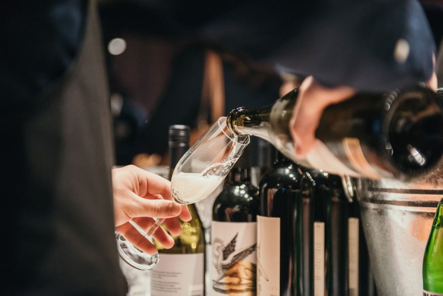 Waiter serving sparkling wine