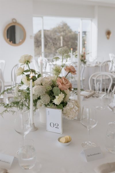 Table setting with white and pink flowers