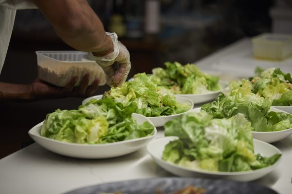 Chef dressing salad